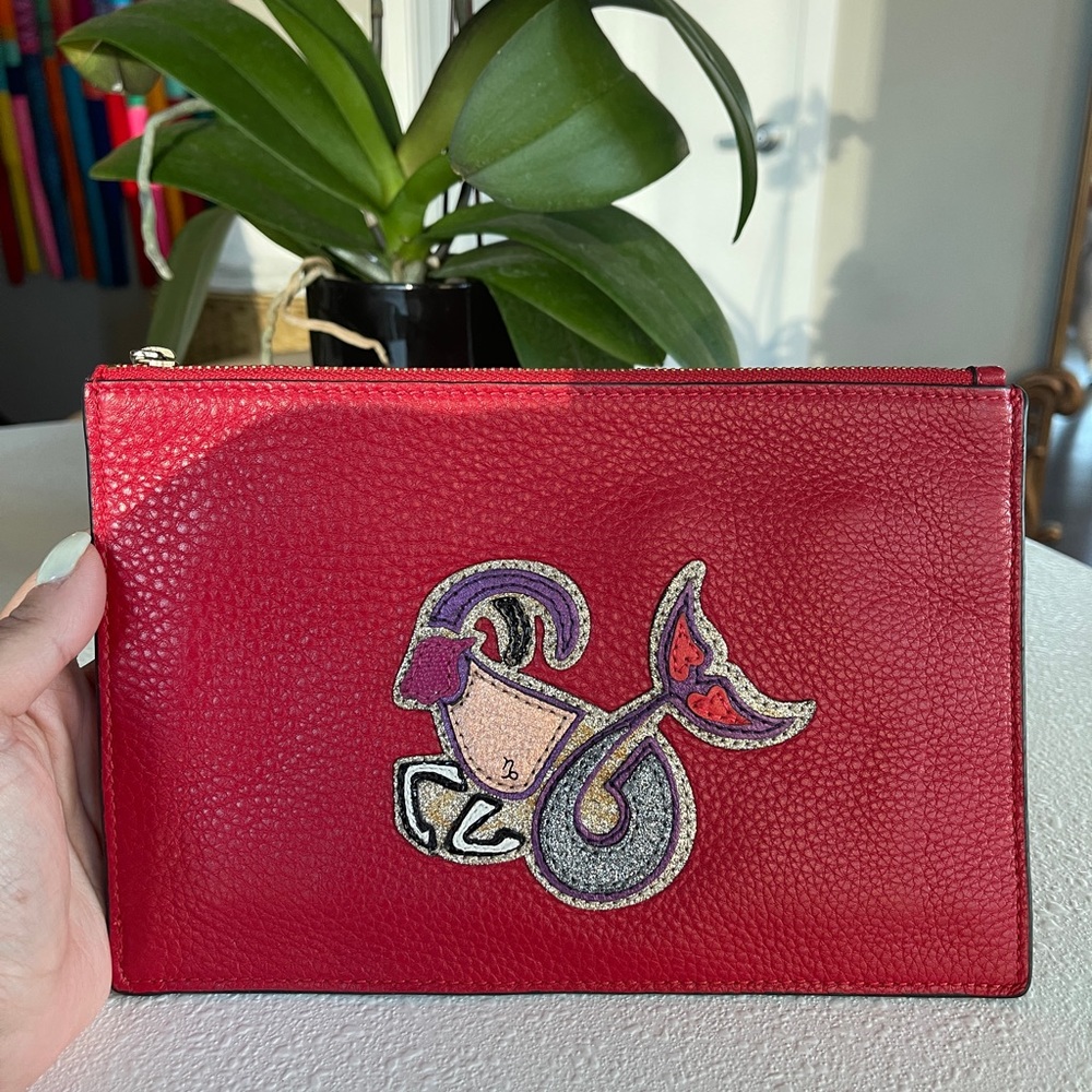 DVF astrology red clutch